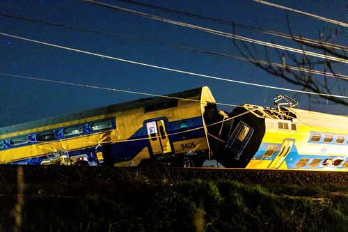 A general view shows aftermath following the derailment of a passenger train after it hit construction equipment on the track, in Voorschoten