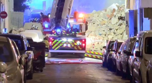 A fire truck stands next to a collapsed building in Marseille