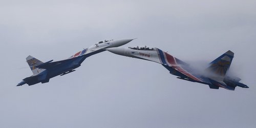 FILE PHOTO: Sukhoi Su-27 Flanker fighters of the Russkiye Vityazi aerobatic display team perform during a demonstration flight at the opening ceremony of the International Army Games in Alabino, outside Moscow, Russia
