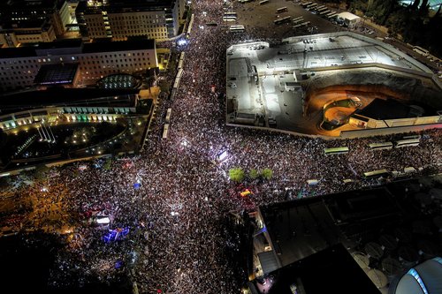 An aerial view shows right-wing demonstrators at a protest calling on the Israeli government to complete its planned judicial overhaul, in front of the Knesset, Israel's Parliament, in Jerusalem