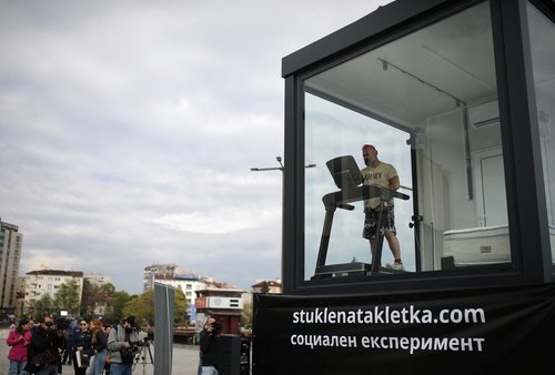 Bulgarian ultramarathon runner self-isolates in a glass cage as part of a social experiment aimed to raise donations, in Sofia