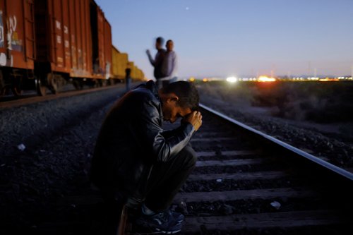 The Wider Image: Migrants risk life and limb to jump Mexico trains in rush to border