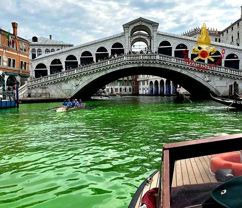 Venice's waters turn green due to an unknown substance near the Rialto Bridge