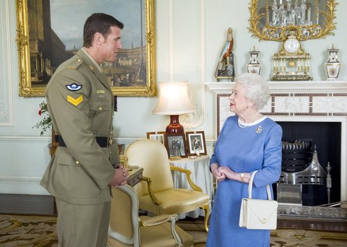 FILE PHOTO: Britain's Queen Elizabeth II greets Australian SAS Corporal Ben Roberts-Smith, who was recently awarded the VC, during an audience at Buckingham Palace in London