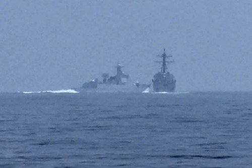 Chinese warship crosses the path of U.S. Navy destroyer USS Chung-Hoon in the Taiwan Strait
