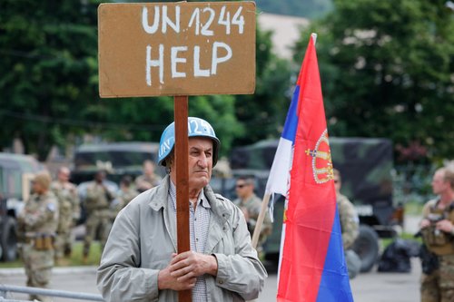 Members of the NATO-led Kosovo Force (KFOR) stand guard in Leposavic