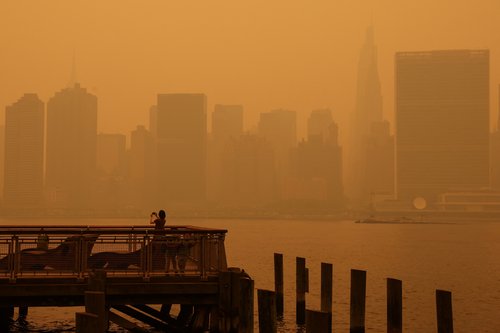 Haze and smoke shroud Manhattan skyline from Canadian wildfires in New York