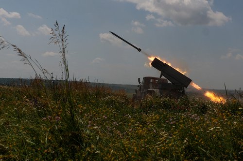 Ukrainian servicemen fire a BM-21 Grad multiple launch rocket system towards Russian troops near a front line in Zaporizhzhia region