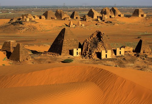 FILE PHOTO: Creeping desert sands surround the Royal Cemeteries of Meroe Pyramids in Begrawiya at River Nile State
