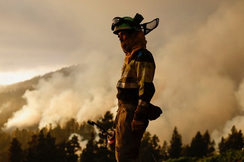 A forest firefighter from the EIRIF works during the extinction of the Tijarafe fire on the Canary Island of La Palma
