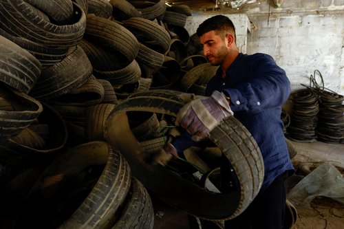 Palestinian man turns wasted car tires into environment-friendly materials, in Gaza