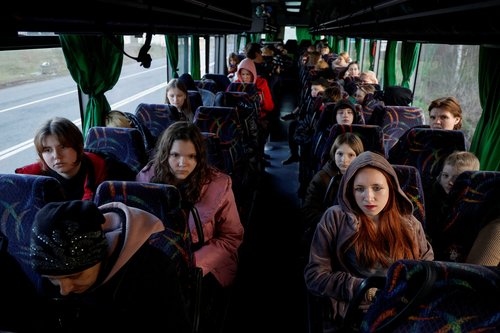 FILE PHOTO: Children taken to Russia wait for departure to Kyiv after returning via the Ukraine-Belarus border in Volyn region