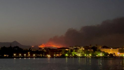 Smoke rises from a wildfire on Corfu Island