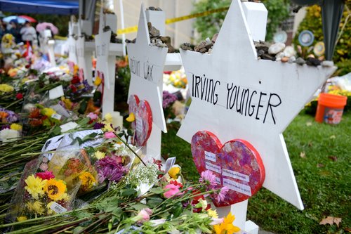 FILE PHOTO: People gathered outside the Tree of Life synagogue in Squirrel Hill to hold a vigil a week after a deadly shooting there