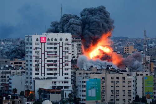 Smoke and flames billow after Israeli forces struck a high-rise tower in Gaza City