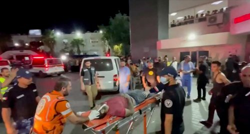 Injured people are taken into hospital after Israeli air strike hit a hospital , according to Hamas Health Ministry