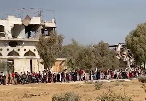 IDF handout footage shows what Israeli army says are Palestinians evacuating south, in location given as Gaza