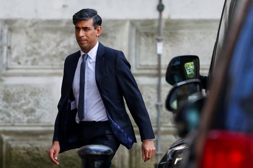 Britain's Prime Minister Rishi Sunak walks outside 10 Downing Street, in London