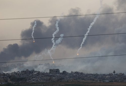 Flares fall over Gaza, as seen from southern Israel