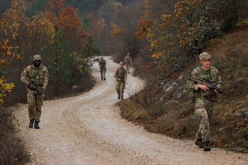 British troops part of the NATO reinforcements patrol at the Kosovo-Serbia border, in Jarinje