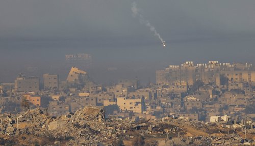 A flare falls over Gaza, after a temporary truce between Israel and the Palestinian Islamist group Hamas expired, as seen from southern Israel