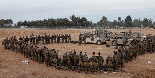 FILE PHOTO: Israeli soldiers stand in order, amid the ongoing conflict between Israel and the Palestinian Islamist group Hamas, near Israel's border with Gaza, in southern Israel