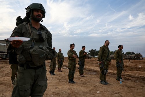 Israeli soldiers pray near border with Gaza Strip, in Beeri