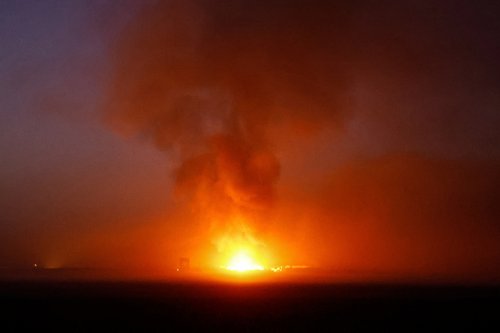 Fire burns in Gaza as seen from southern Israel