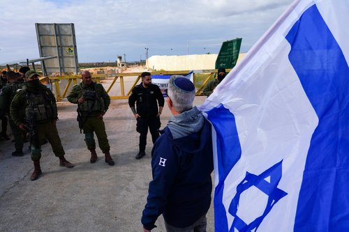 Families of hostages and supporters protest against the delivery of humanitarian aid to Gaza, in Kerem Shalom