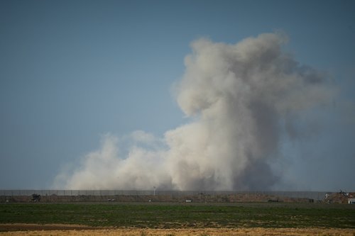 Smoke rises during an explosion in Gaza