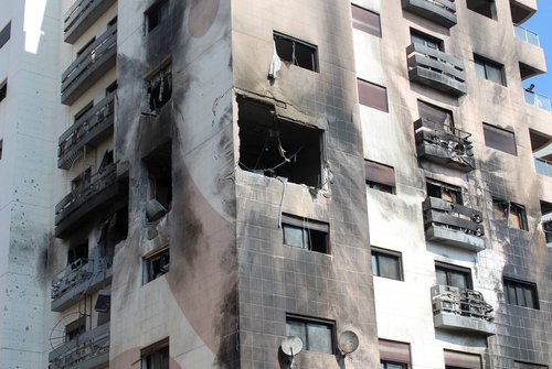 A view shows a damaged building in the Kafr Sousa district of Damascus