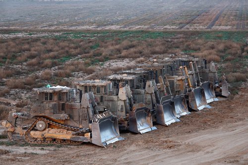 D9 bulldozers are parked near the Israel-Gaza border, in Southern Israel