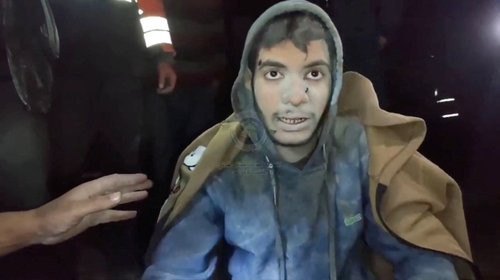 Workers search for casualties among rubble, in Gaza City