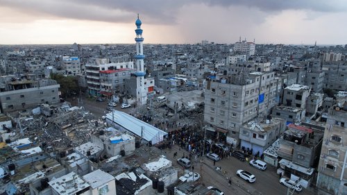 Palestinians hold Eid al-Fitr prayers by the ruins of al-Farouk mosque in Rafah