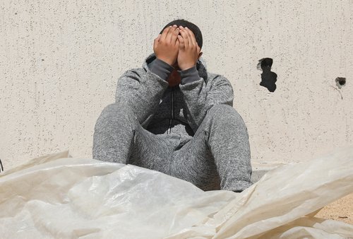 Displaced Palestinians who fled Rafah, ahead of a threatened Israeli assault, travel in Al-Mawasi area, in Khan Younis