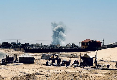 Smoke rises following Israeli strikes, in Rafah