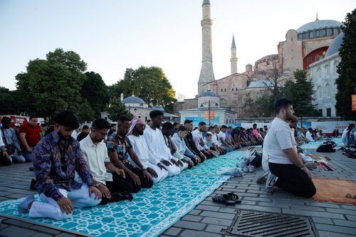 Worshippers attend Eid al-Adha prayers outside the Hagia Sophia Grand Mosque in Istanbul