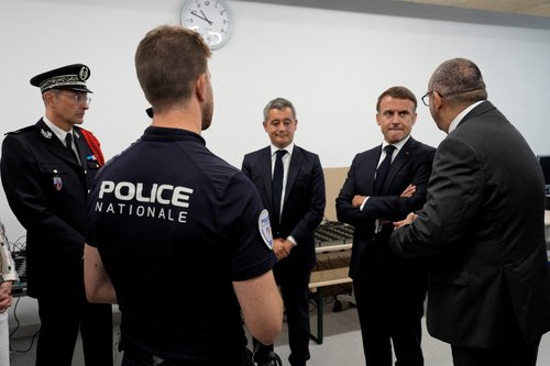 FILE PHOTO: French President Emmanuel Macron visits the Olympic village in Paris