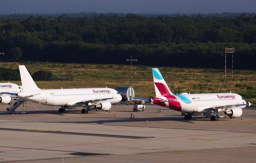 A view of airplanes parked on the tarmac at Cologne-Bonn airport