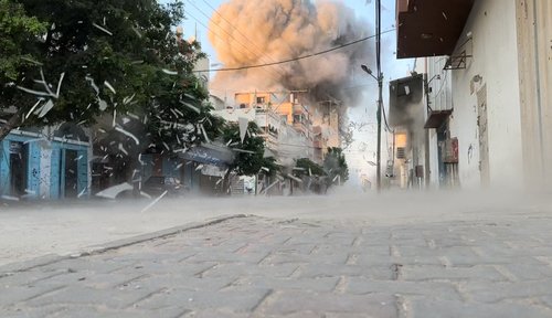Smoke rises following an Israeli strike on a residential building, in Nuseirat in the central Gaza Strip