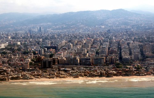 An aerial view from an airplane window shows the coast at the Lebanese capital Beirut