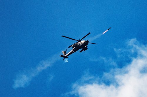 An Israeli attack helicopter fires towards Lebanon, amid cross-border hostilities between Hezbollah and Israel, as seen from northern Israel