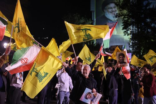 Iranians celebrate on a street, after the IRGC attack on Israel, in Tehran