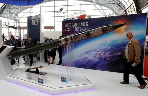 FILE PHOTO: A man looks at a Patriot Advanced Capability (PAC-3) Missile Segment Enhancement (MSE) model by Lockheed Martin at an international military fair in Kielce