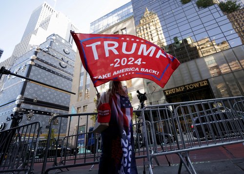 FILE PHOTO: People react after U.S. President-elect Donald Trump won the election, in New York