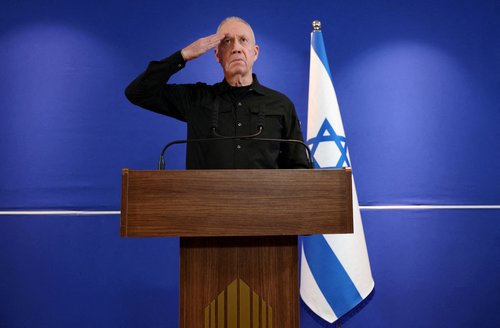 Former Israeli Defense Minister Yoav Gallant speaks to members of the press, in Tel Aviv