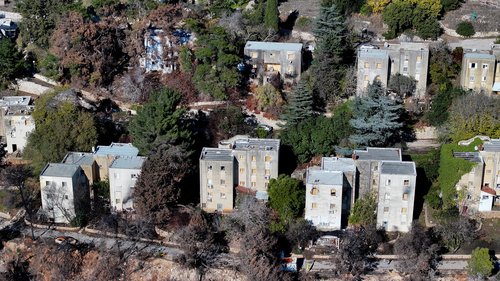A drone view shows damage in Manara