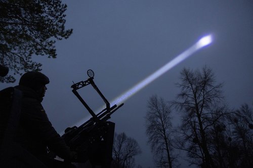 Judge and spokesperson of Bila Tserkva district court Vladyslav Tsukurov observes the sky during a combat shift of his air defence volunteer unit in Kyiv region