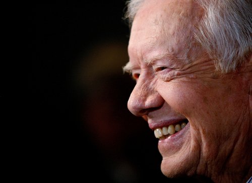 FILE PHOTO: Former U.S. President Carter smiles at premiere of "Jimmy Carter: Man From Plains" during 32nd Toronto International Film Festival