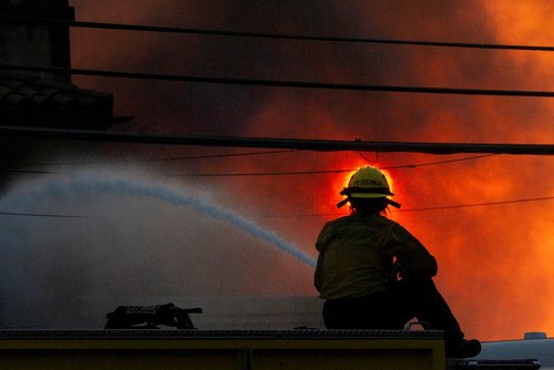 Palisades fire burns during a windstorm on the west side of Los Angeles